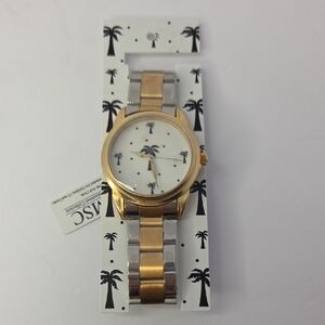 This Mainstreet Collection women's watch features a two-tone and Palm Trees